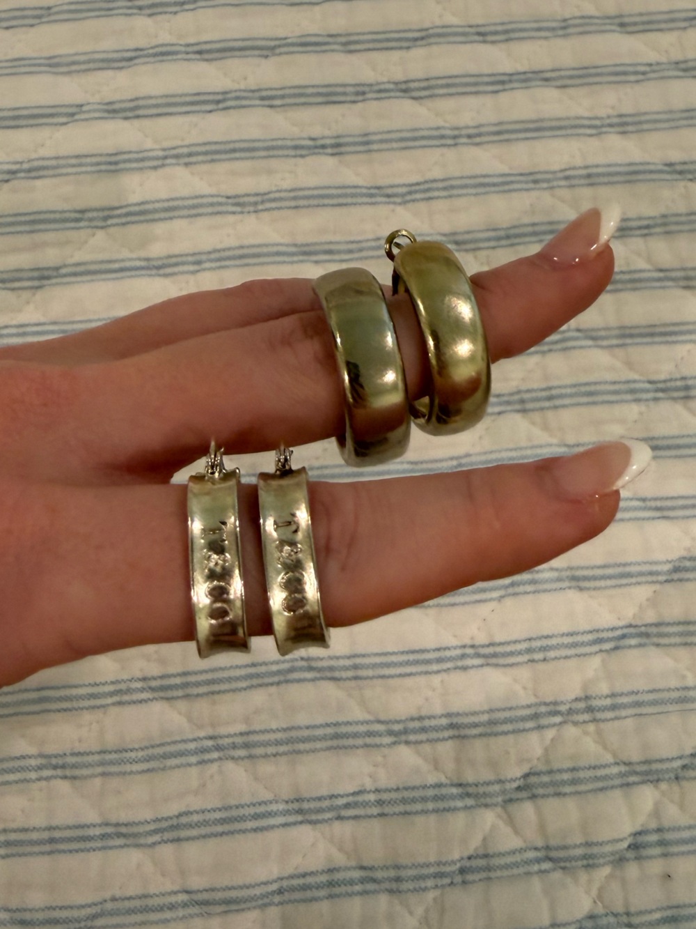 Lot of two silver and gold hoop earrings
